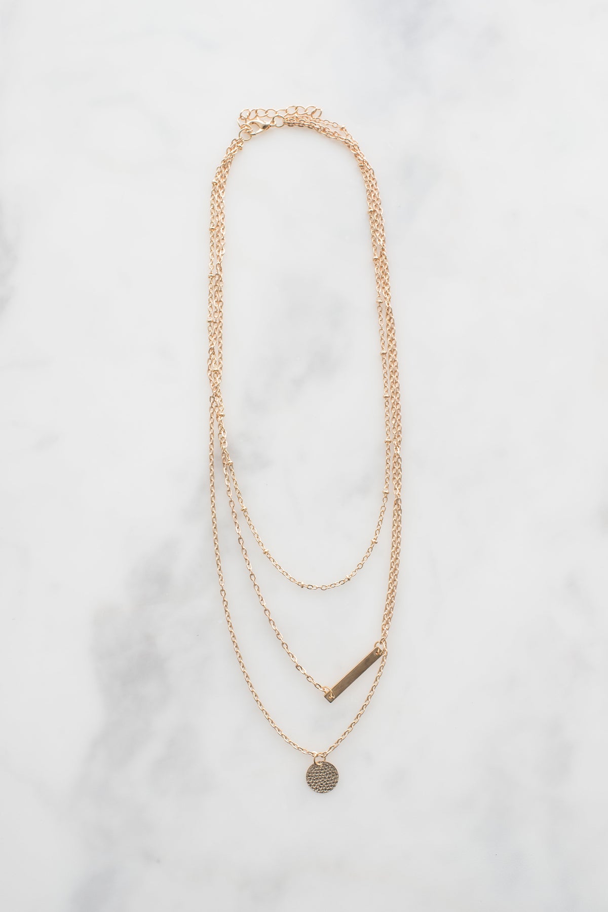 Luna layered necklace on marble