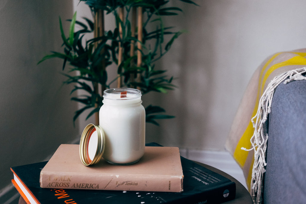 Rose Garden soy candle styled on a side table