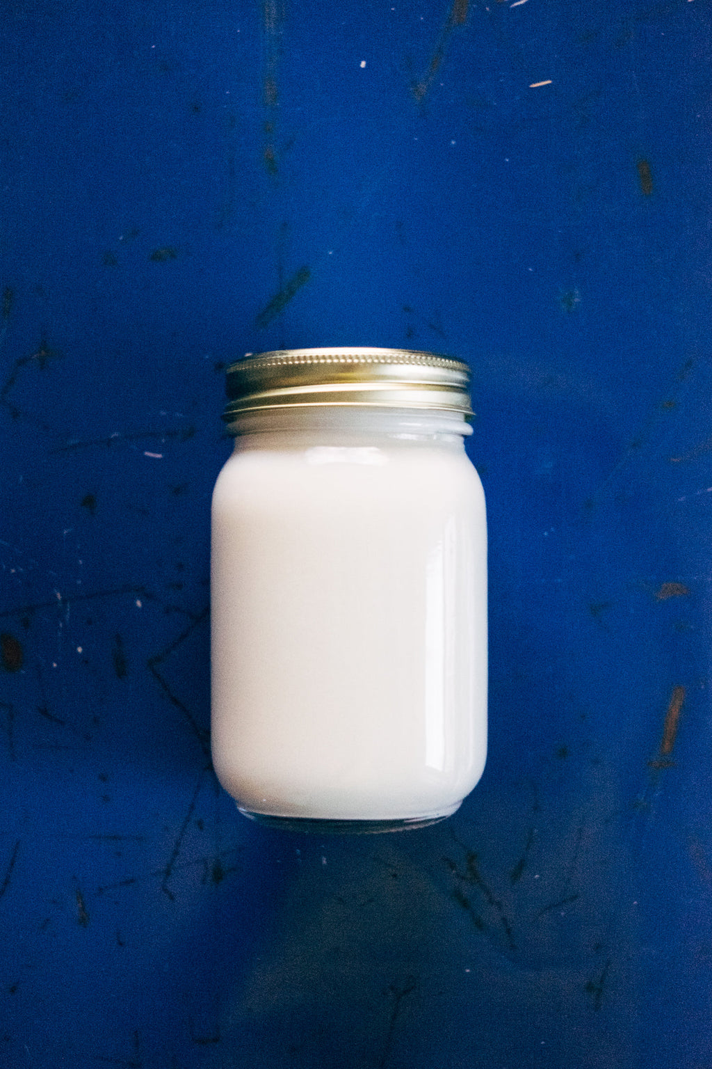 Classic hand-poured soy candle in a glass jar