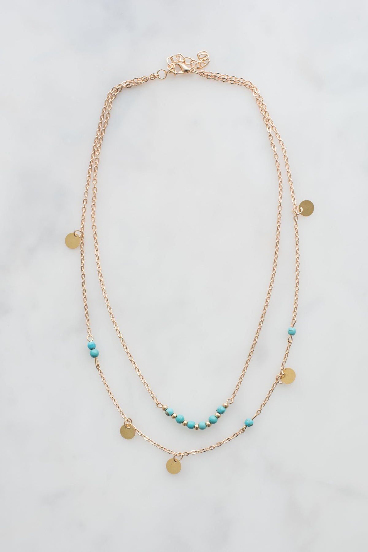 Soleil turquoise coin necklace on marble